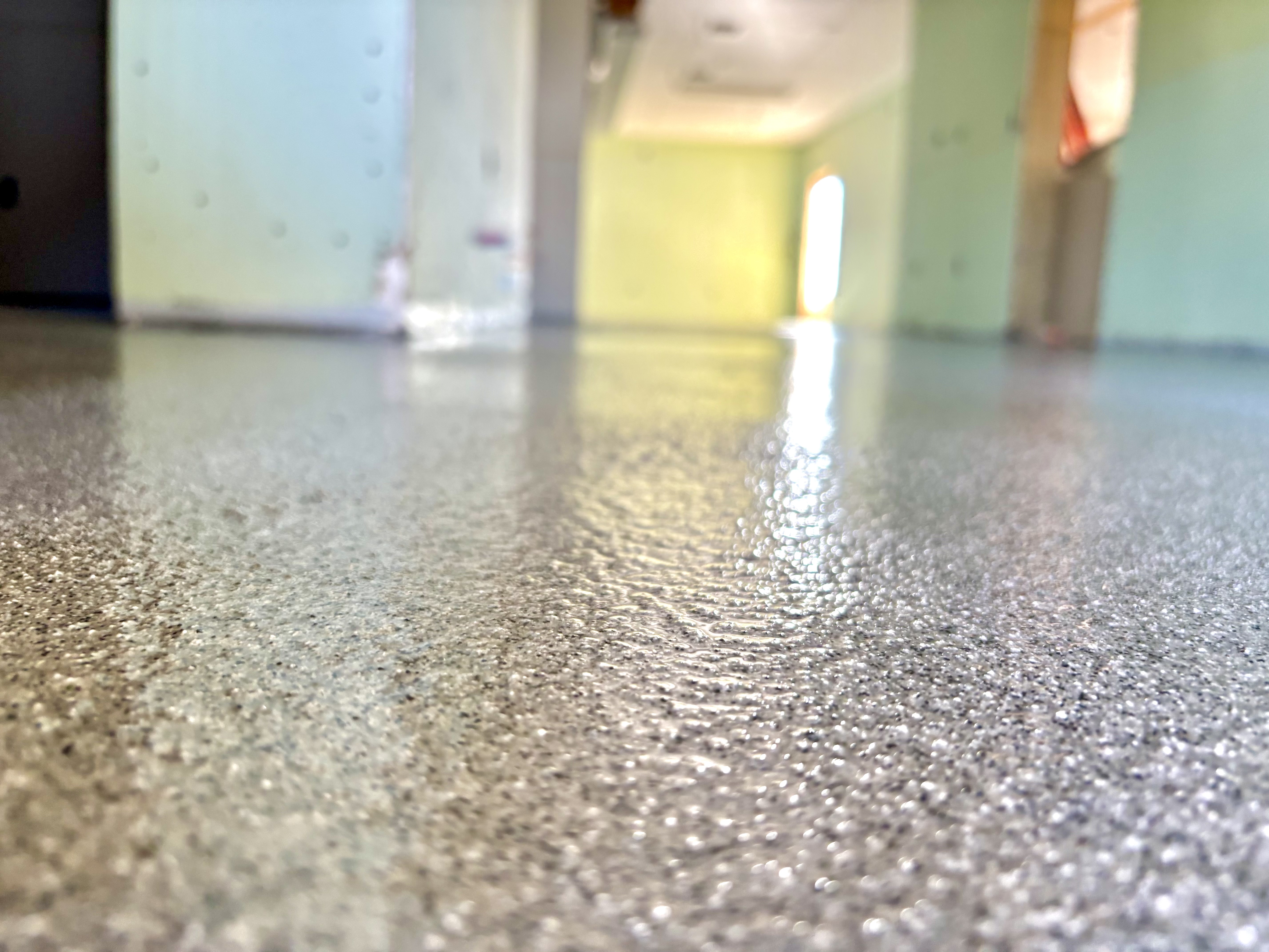Sparkly quartz epoxy floor with silver glitter finish by Carpenter Coating